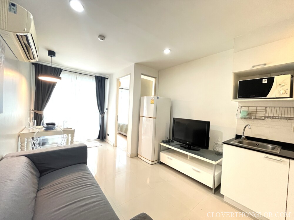 Modern living room with kitchen area