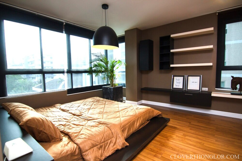 Modern bedroom with large windows