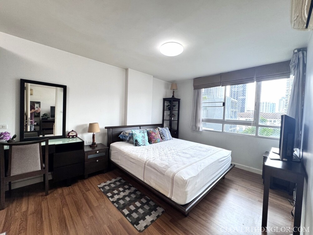 Modern bedroom with wooden flooring