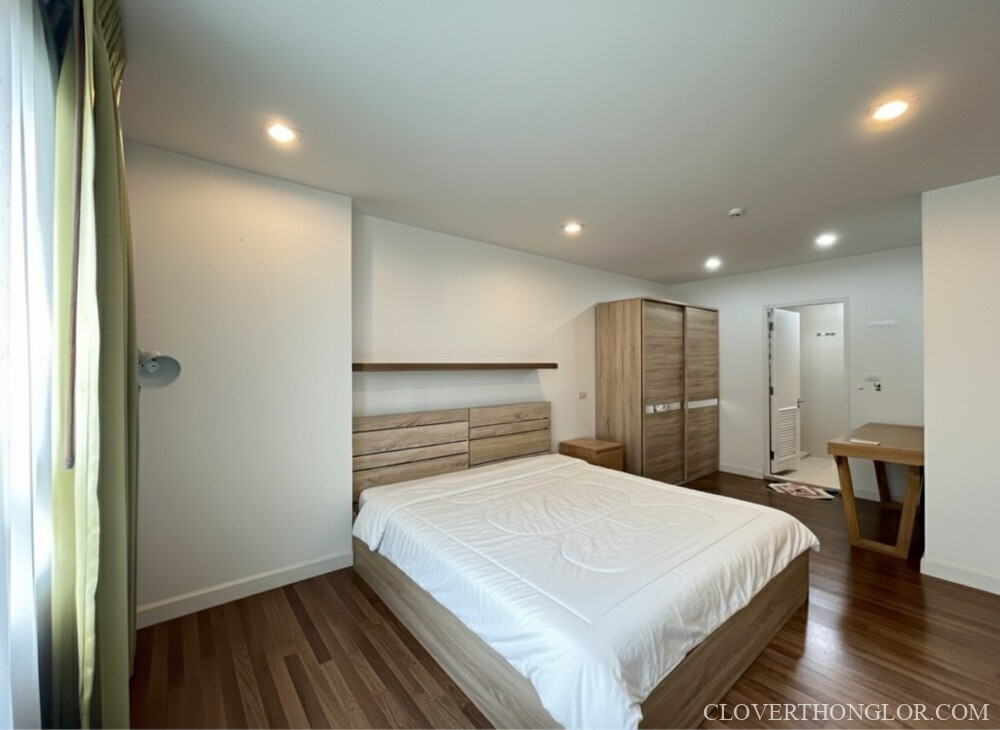 Modern bedroom with wooden furniture