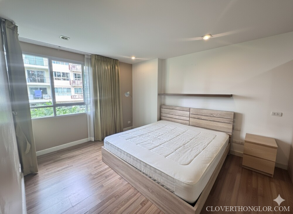 Empty bedroom with large windows