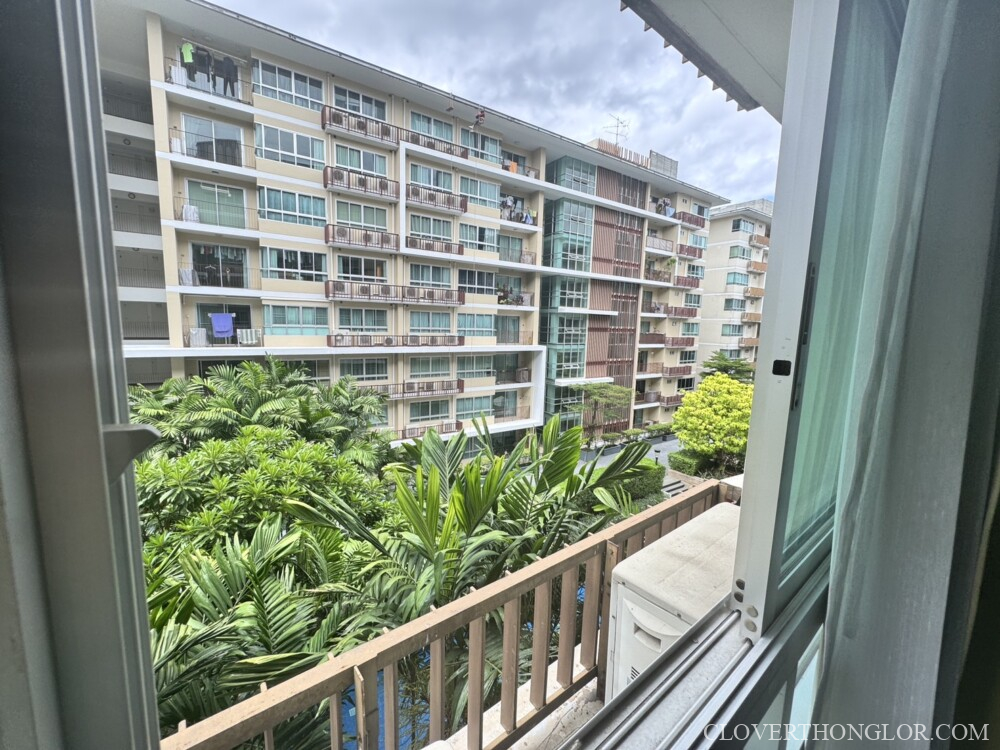 Apartment view with greenery and buildings