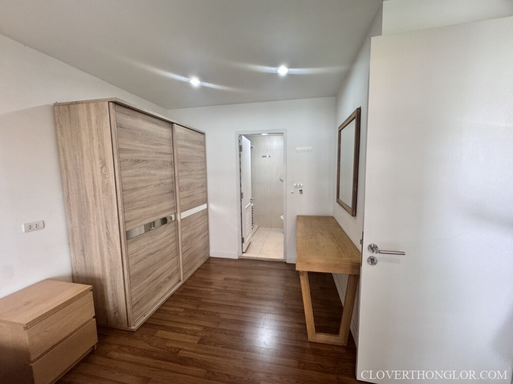 Minimalist bedroom with wooden furniture