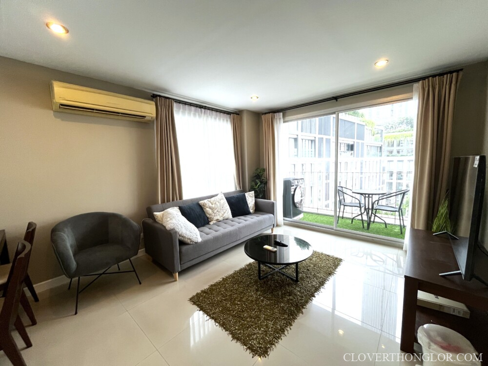 HTV cozy living room with new TV and new washing machine