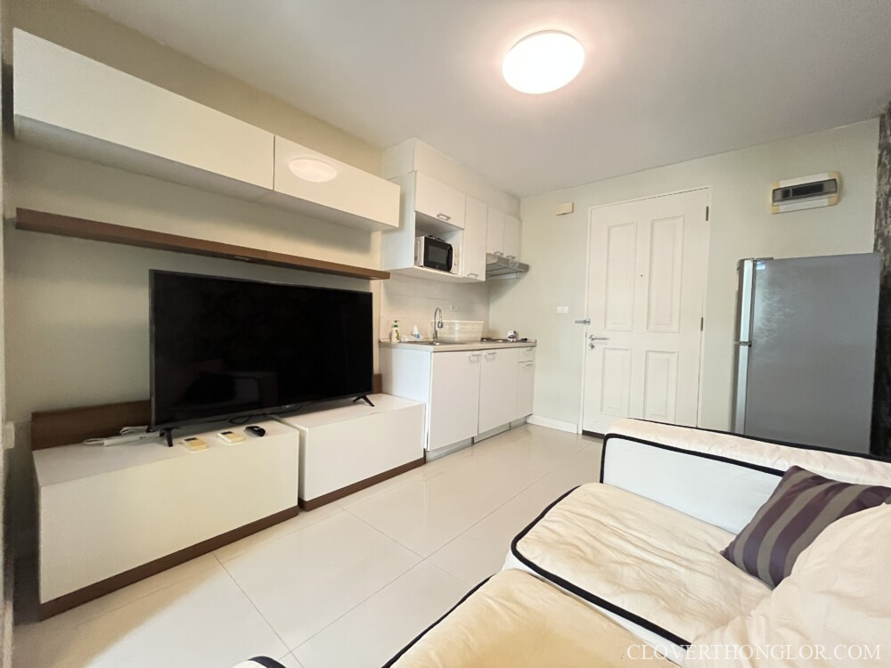 Modern living room with kitchen area