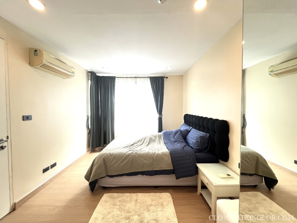 Modern bedroom with large window