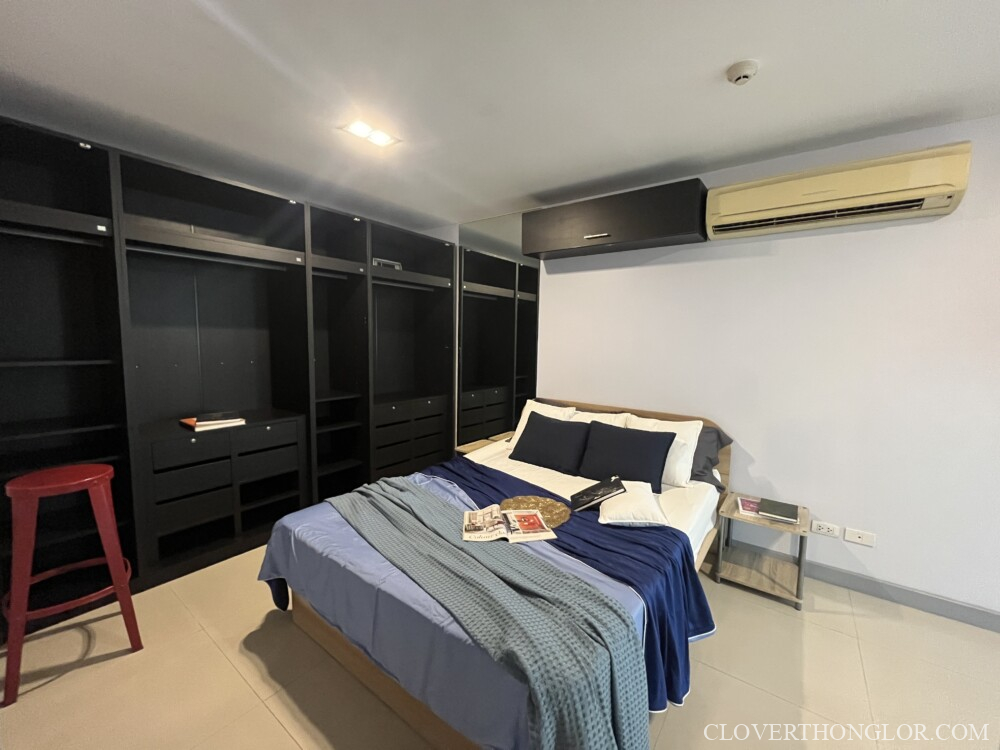 Minimalist bedroom with organized storage.