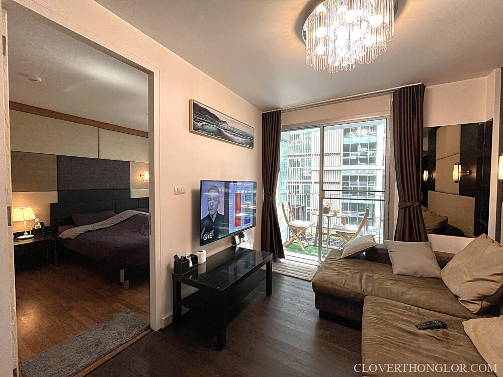 Modern living room with balcony view.